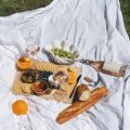a picnic set out on a white blanket