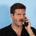man speaking into a phone