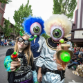 people in alien costumes in a parade