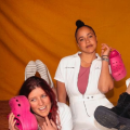 people posing with pink crocs