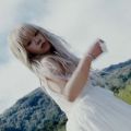 a photo of a woman in a white dress