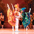 ballet dancers on stage in colorful costumes