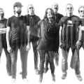 black and white photo of people in a band standing