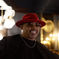 a man in a red hat and sunglasses