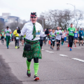 man running in green kilt and socks 