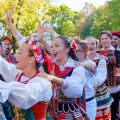 people in traditional polish costumes dancing
