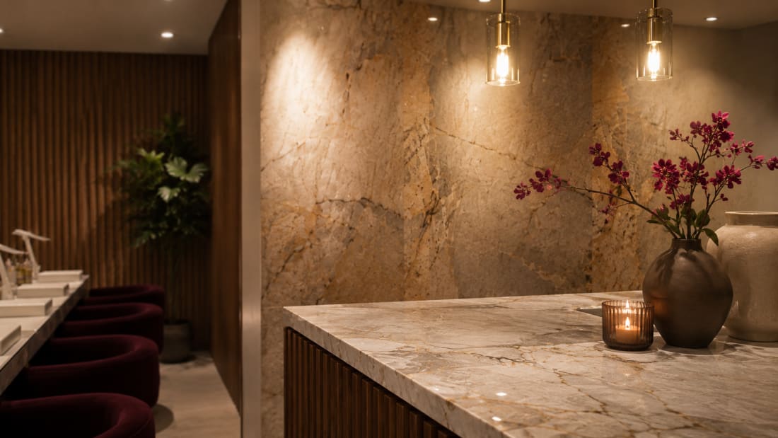 Warm marble counter detail at The Vault Spa
