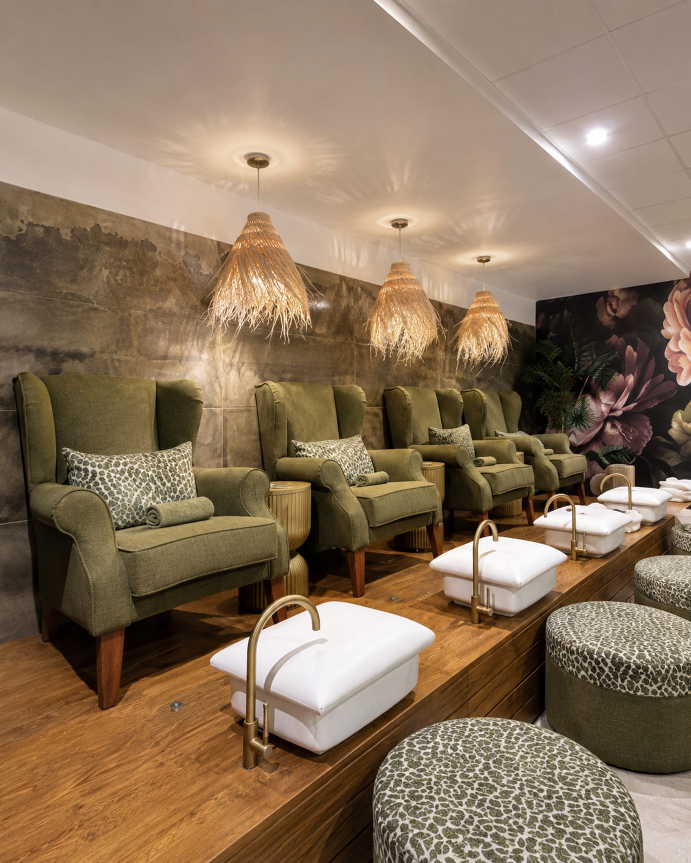 The pedicure lounge with plush chairs