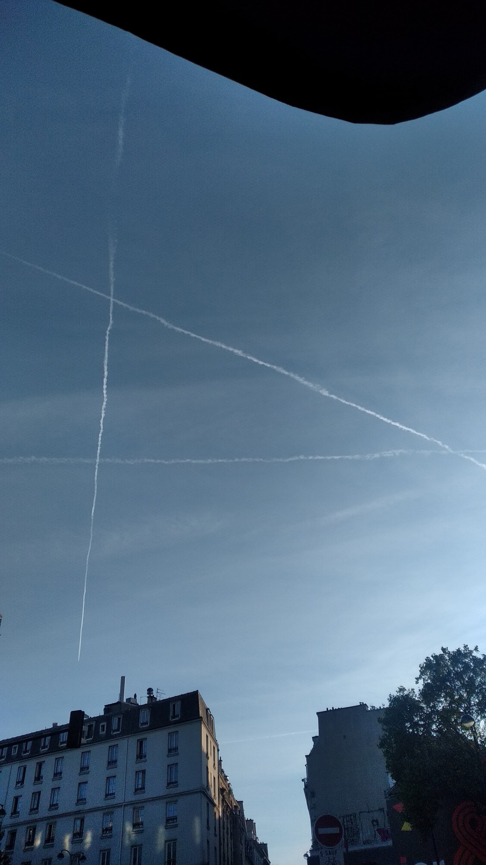 capital - a large triangle is drawn in the sky by three different planes - planes, fumes, sky - paul lahana