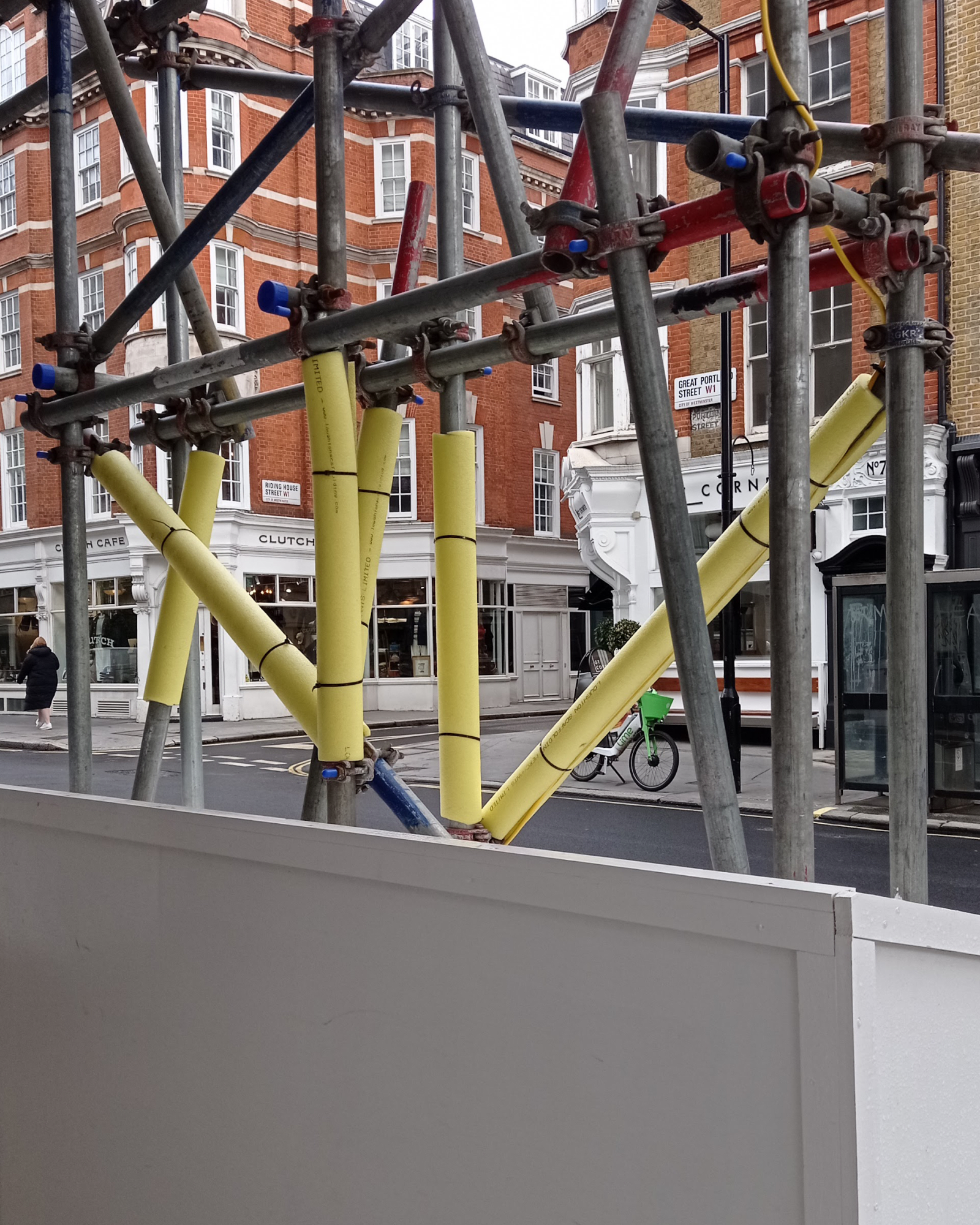 Construction lines - yellow lines are here to protect, gray lines are here to support - yellow foam, scafolding (from UK), blue paint, red paint, building - paul lahana