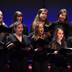 Female singers performing in a choir