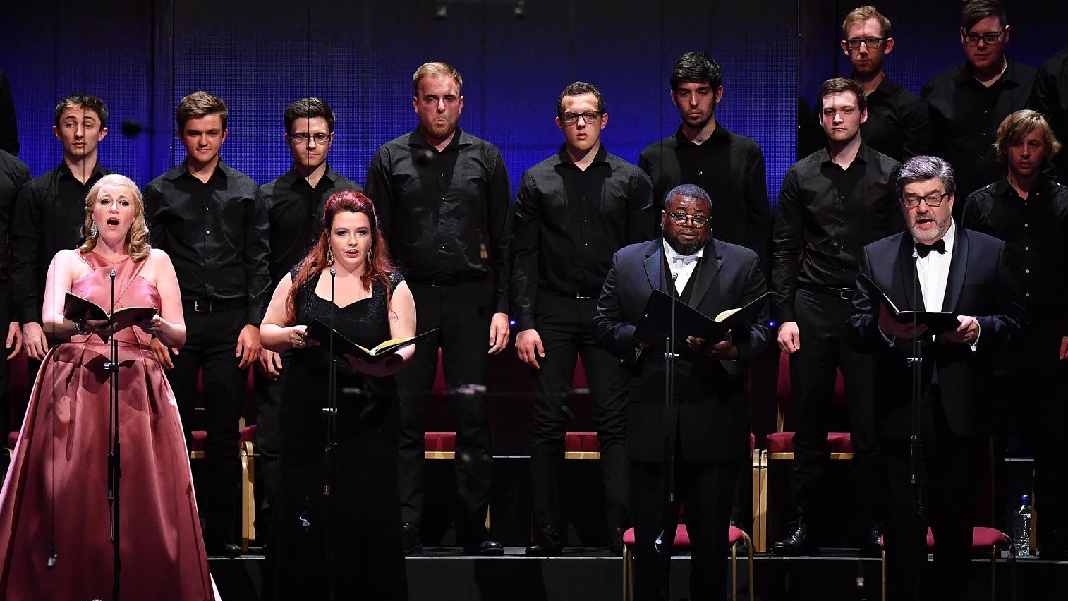 A choir performing on stage at the Royal Albert Hall