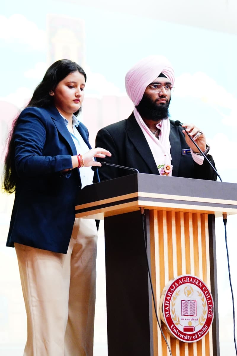 Two speakers, Divjyot Singh and Avishi Daftari, share the podium at the Delhi MUN 1.0 inaugural session