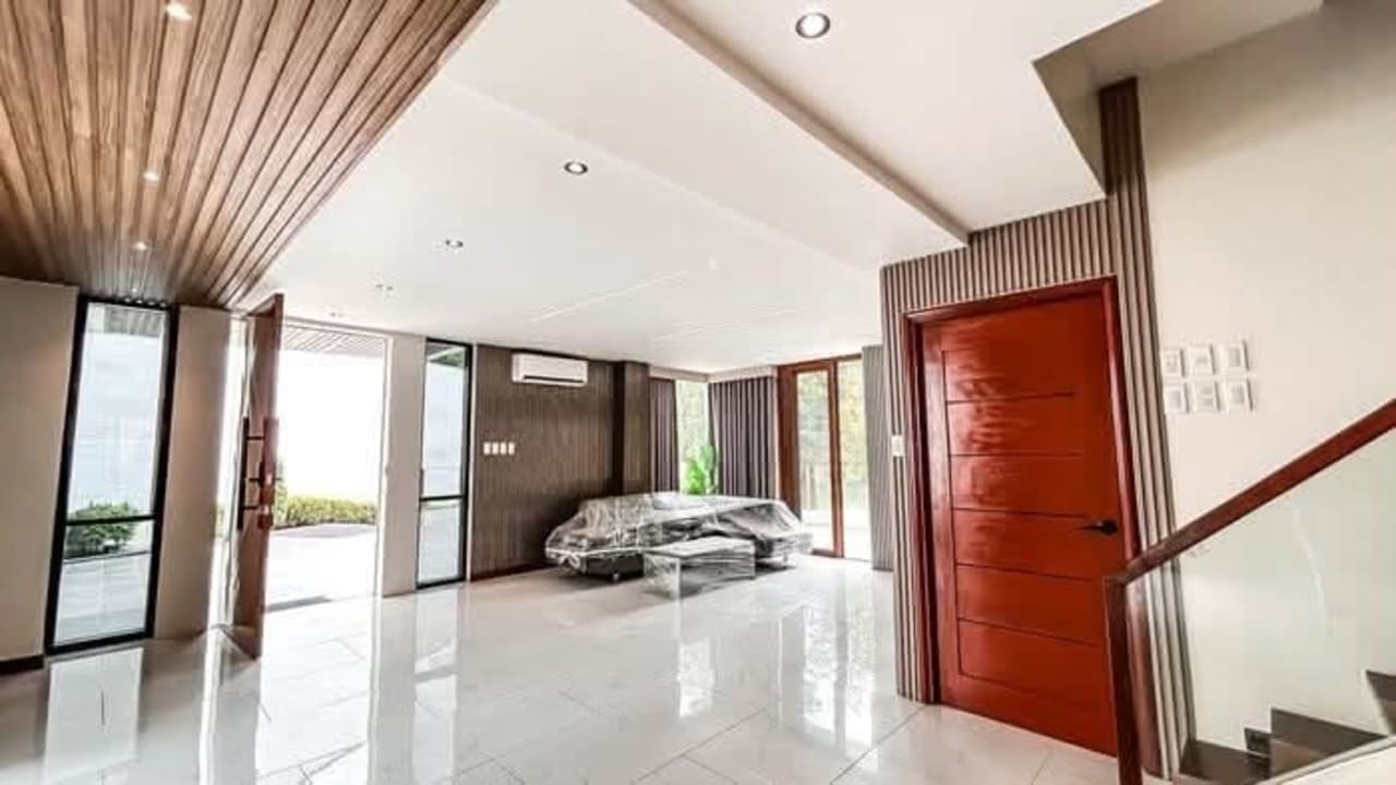Wide living room with large windows in luxury 5-bedroom house for sale in Cebu