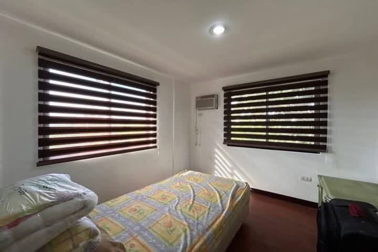 Bed with two windows in House & Lot for Sale in Liloan, Cebu