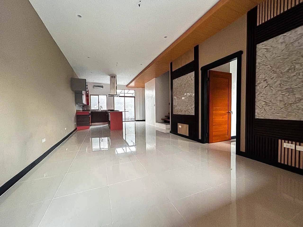 Spacious living room with kitchen in luxury 4-bedroom townhouse in Apas Cebu City