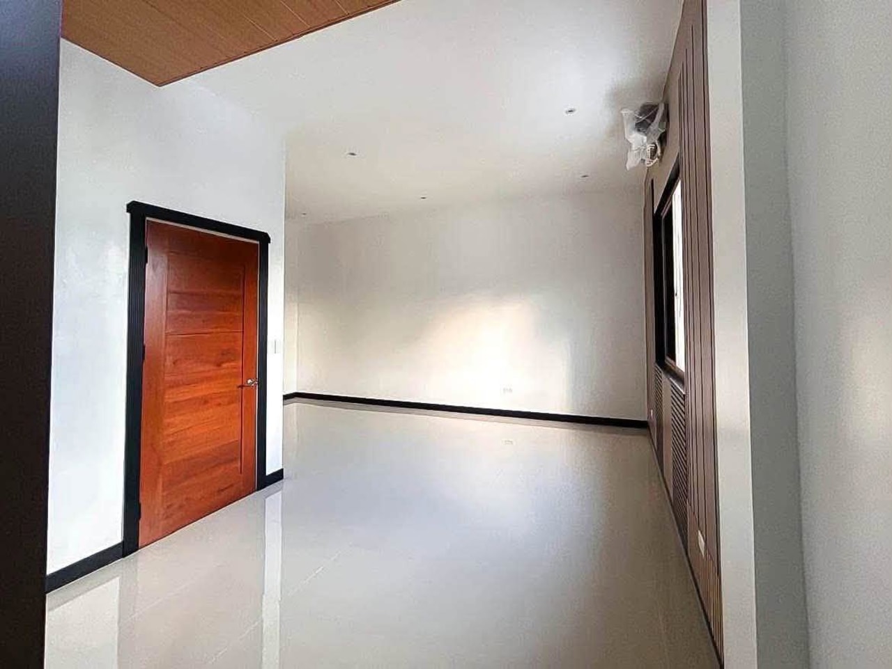 Living room with interior door in 4-bedroom townhouse for sale in Apas Cebu City