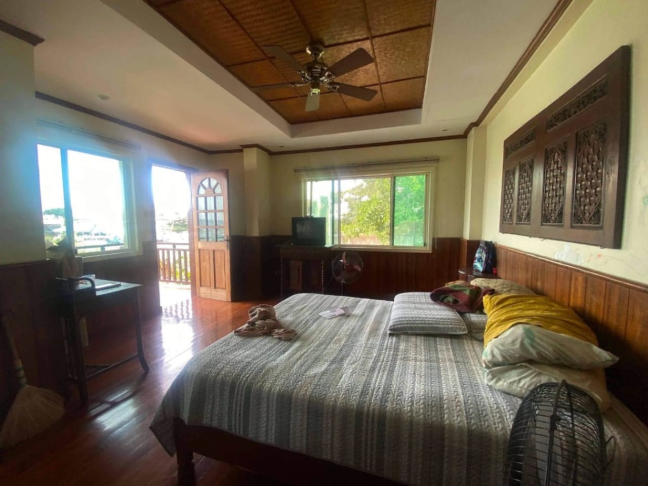 Bedroom interior with windows in waterfront house for sale in Mactan Cebu