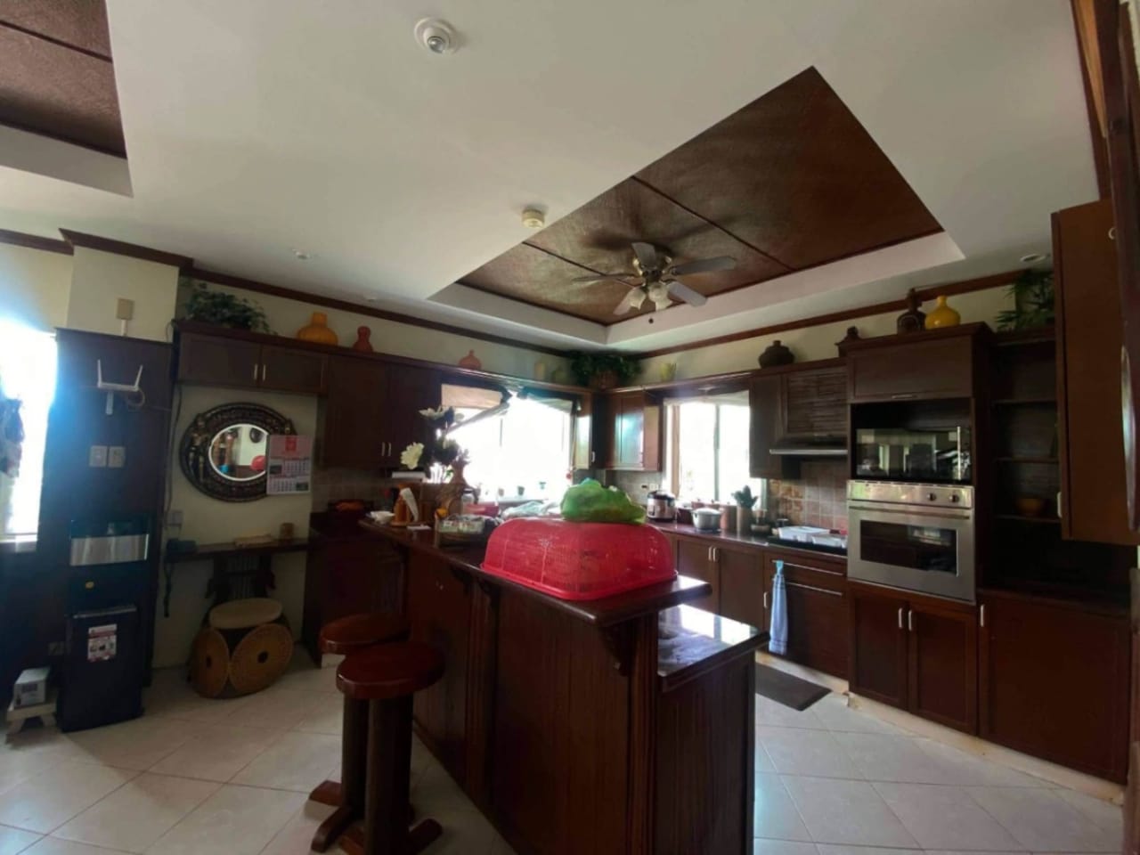 Kitchen with oven and sink inside waterfront house for sale in Mactan Cebu