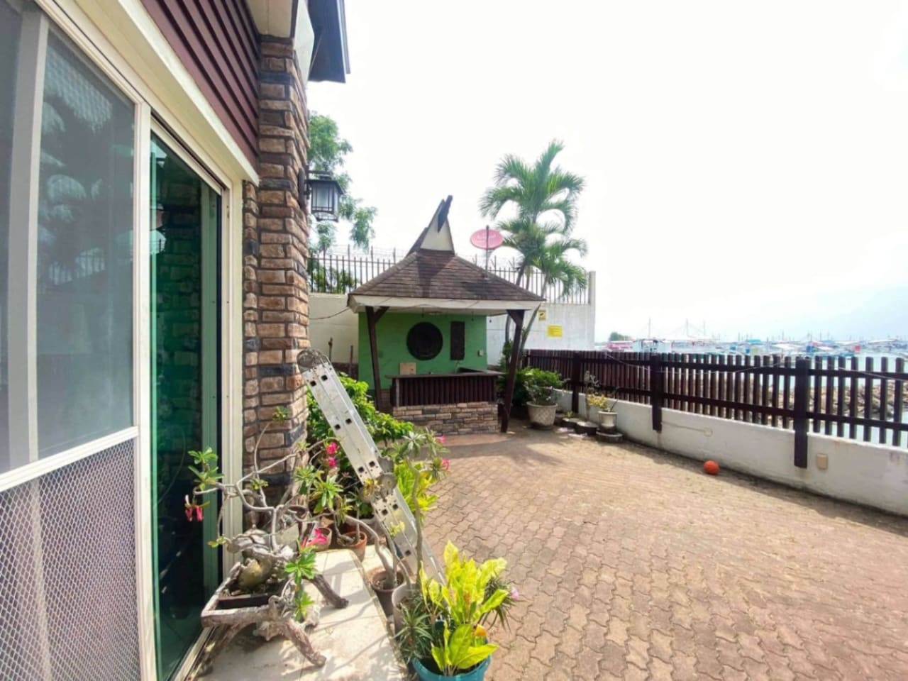 Bahay kubo and outdoor area at waterfront property with direct water access in Mactan