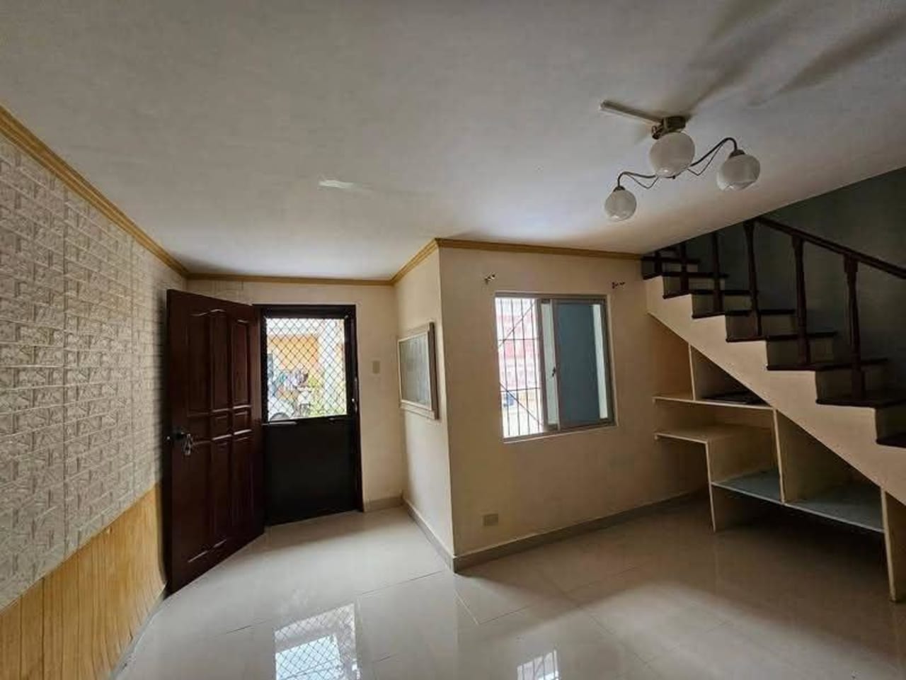 Living room entrance inside renovated 2-bedroom townhouse for sale in Consolacion Cebu