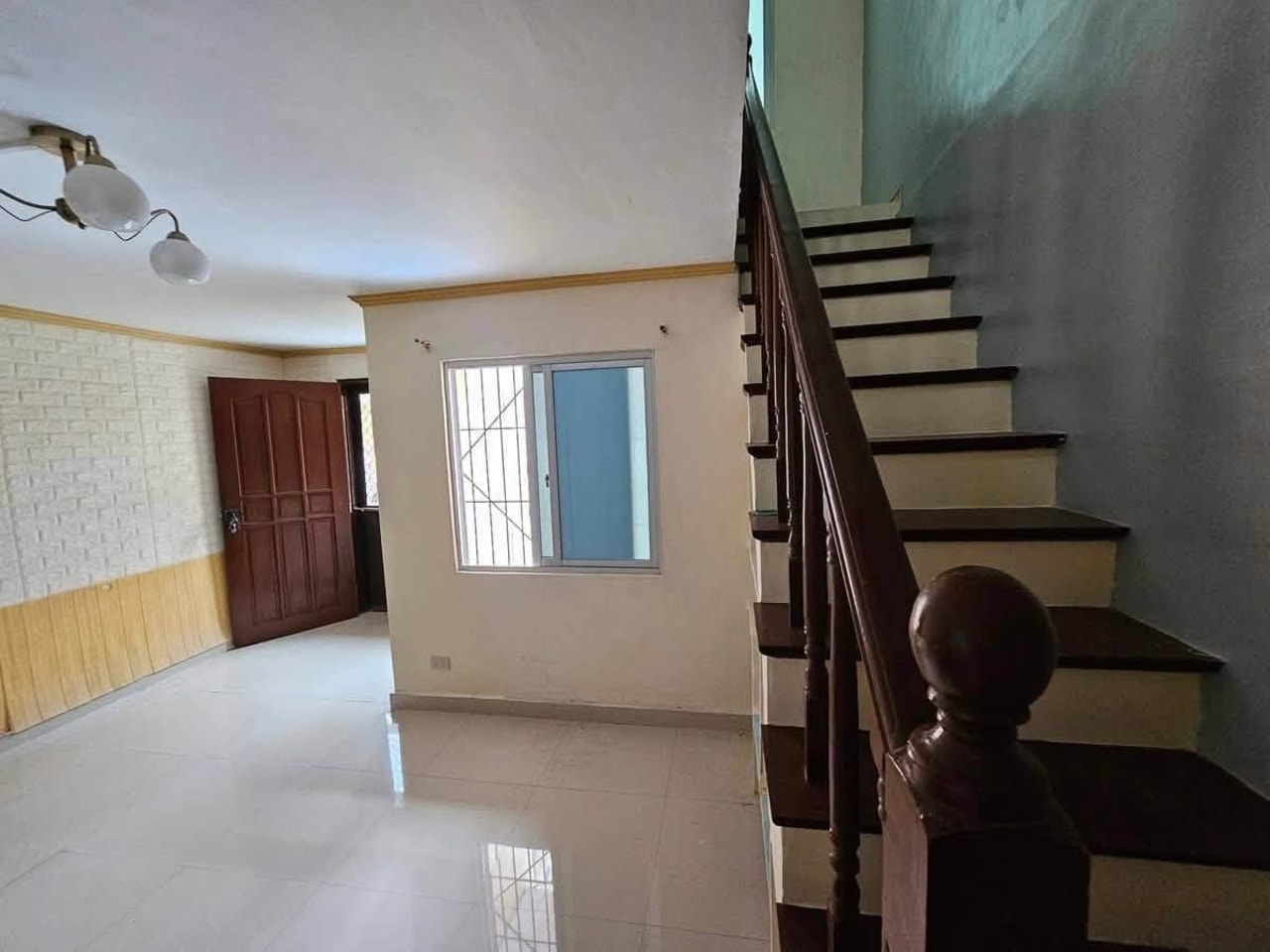 Spacious living area and staircase inside 2-storey townhouse in Consolacion Cebu