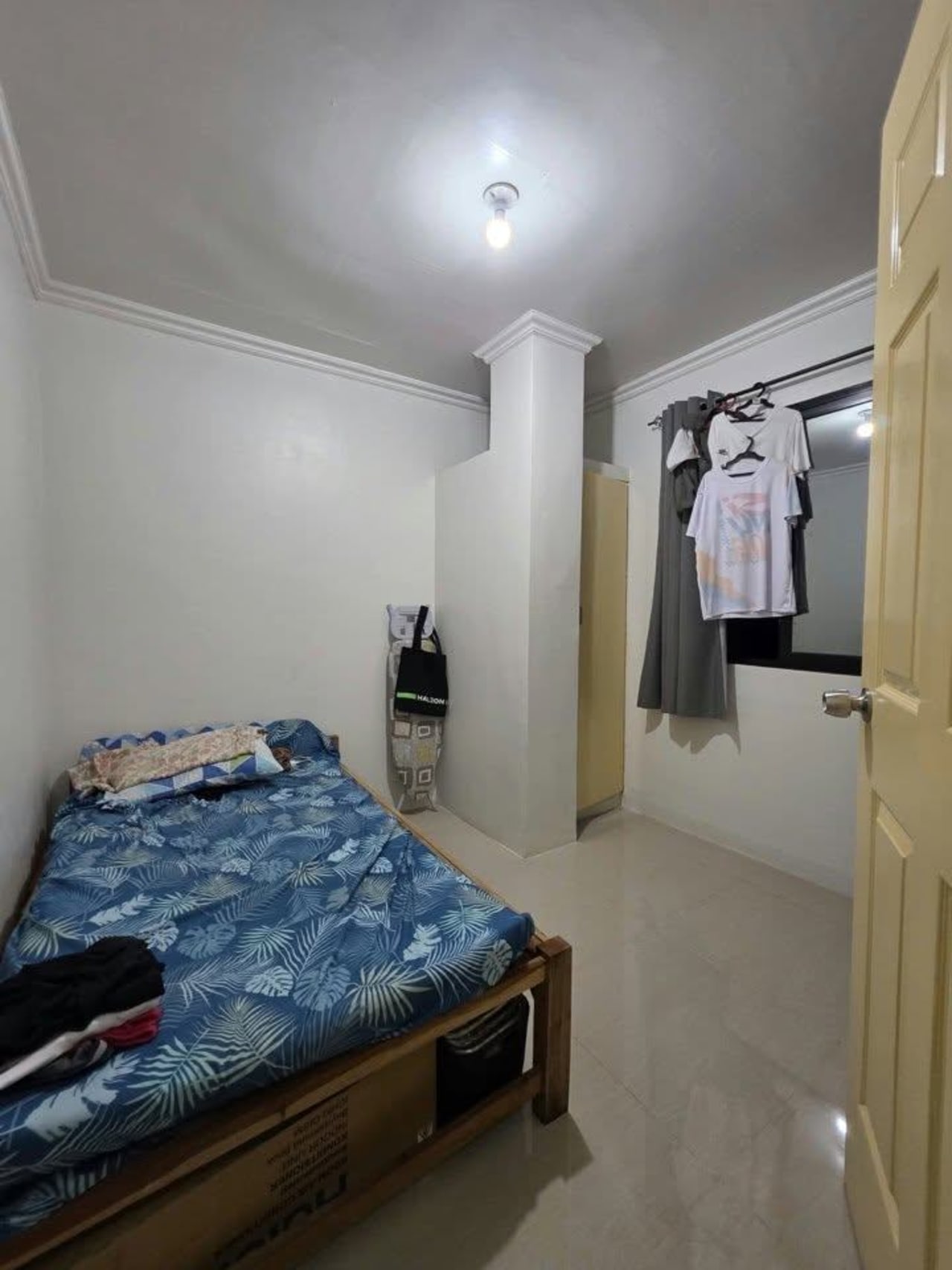 bedroom with blue mattress with white walls house and lot for sale in Tisa