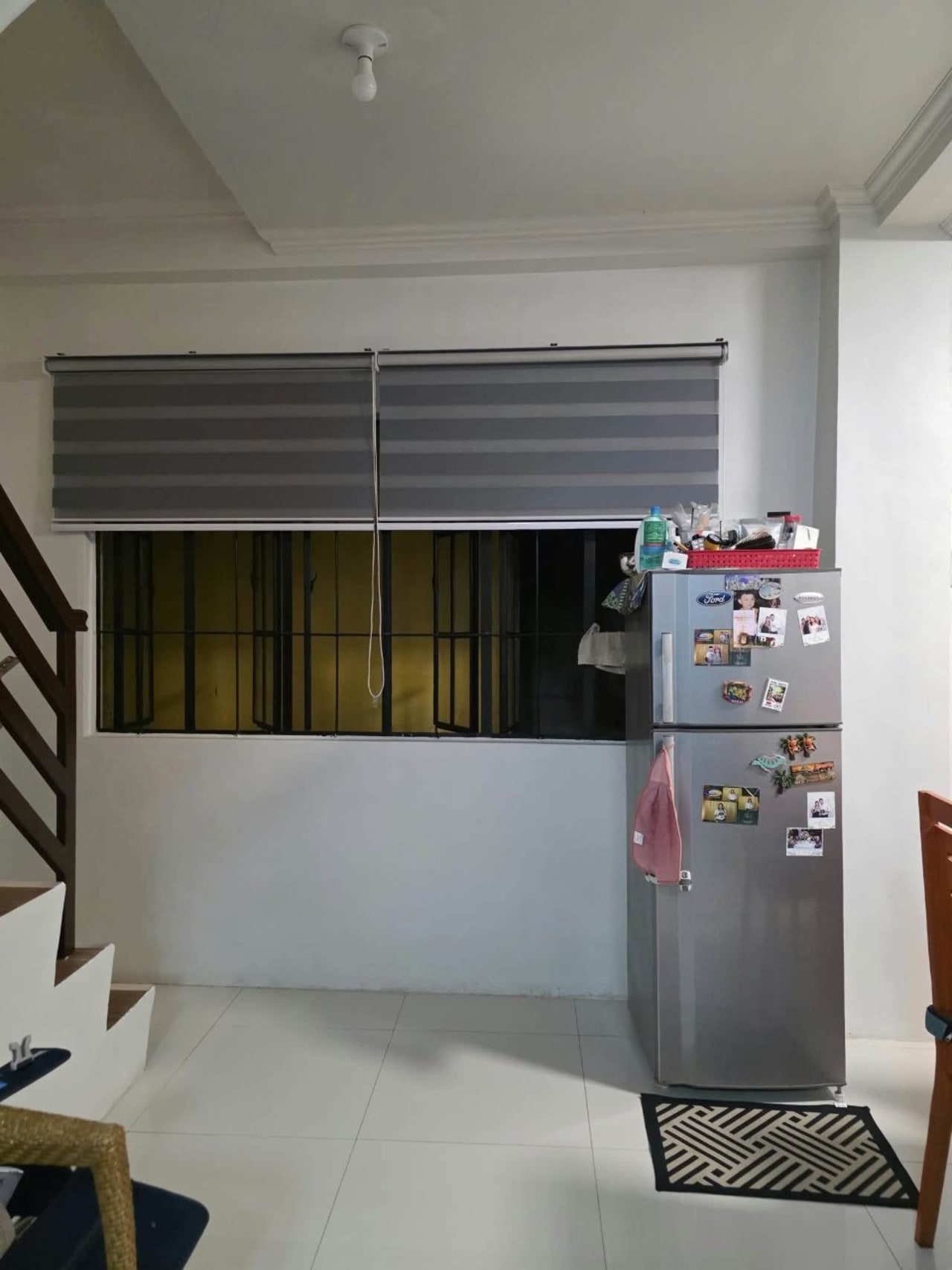 Window beside a gray refrigerator in house and lot for sale in Tisa