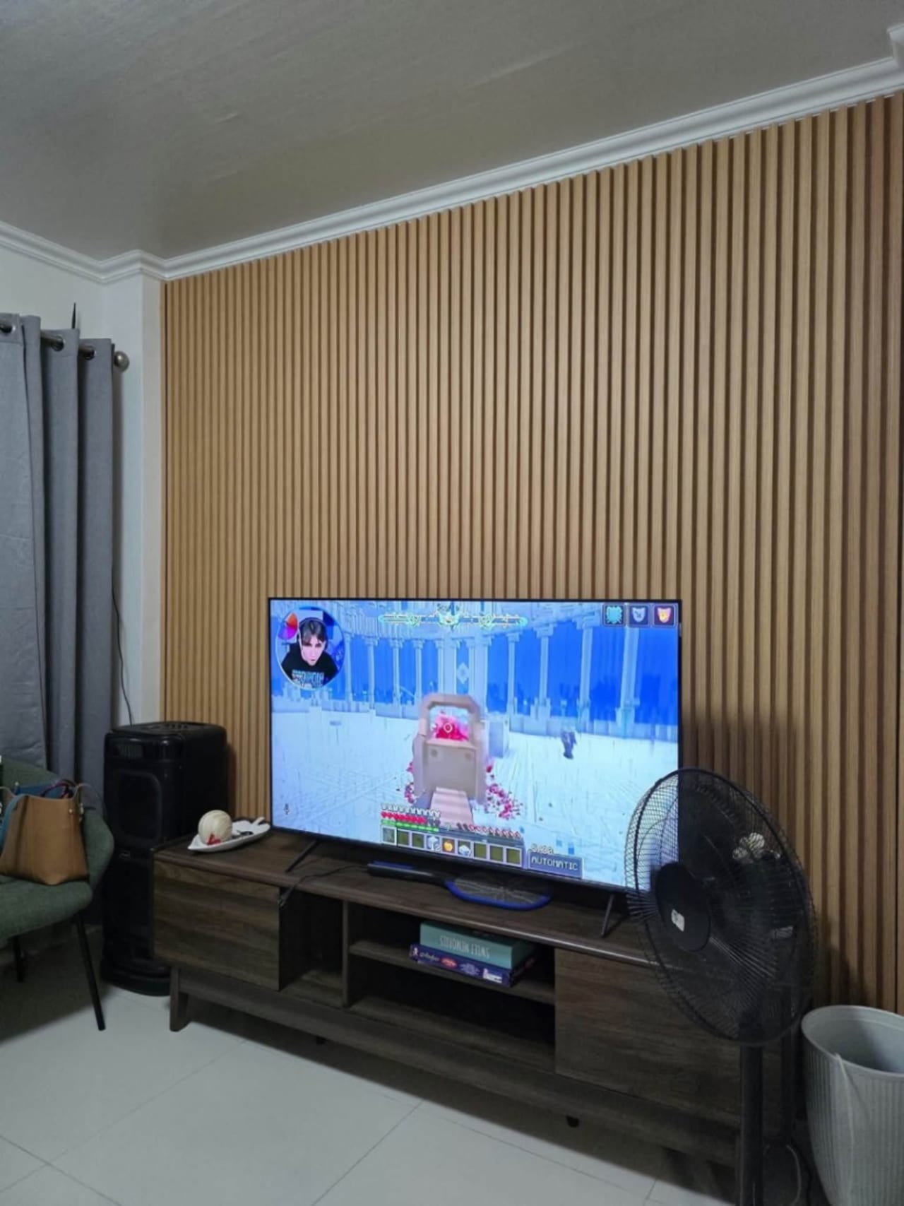TV with brown panels at the back in house and lot for sale in Tisa