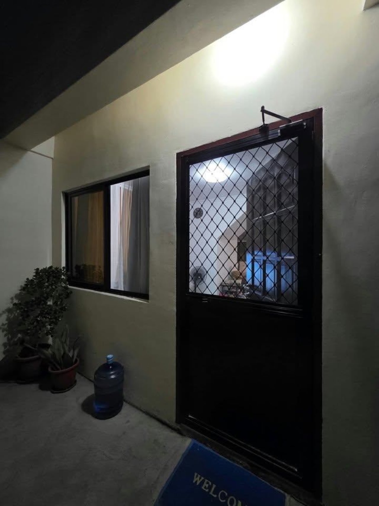 View outside facing the black door in house and lot for sale in Tisa