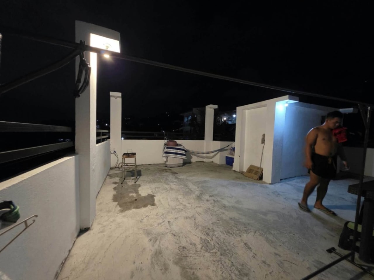 Wide view of the rooftop with white room serves as entrance in house and lot for sale in Tisa