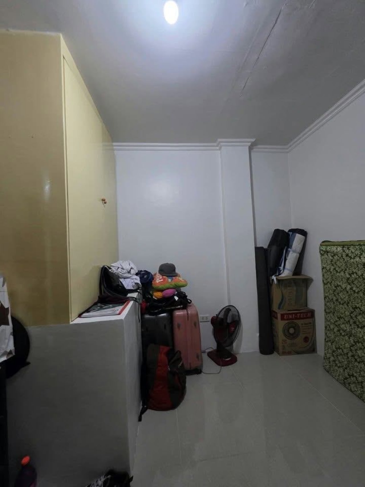 Storage room with bags and luggages with white walls house and lot for sale in Tisa