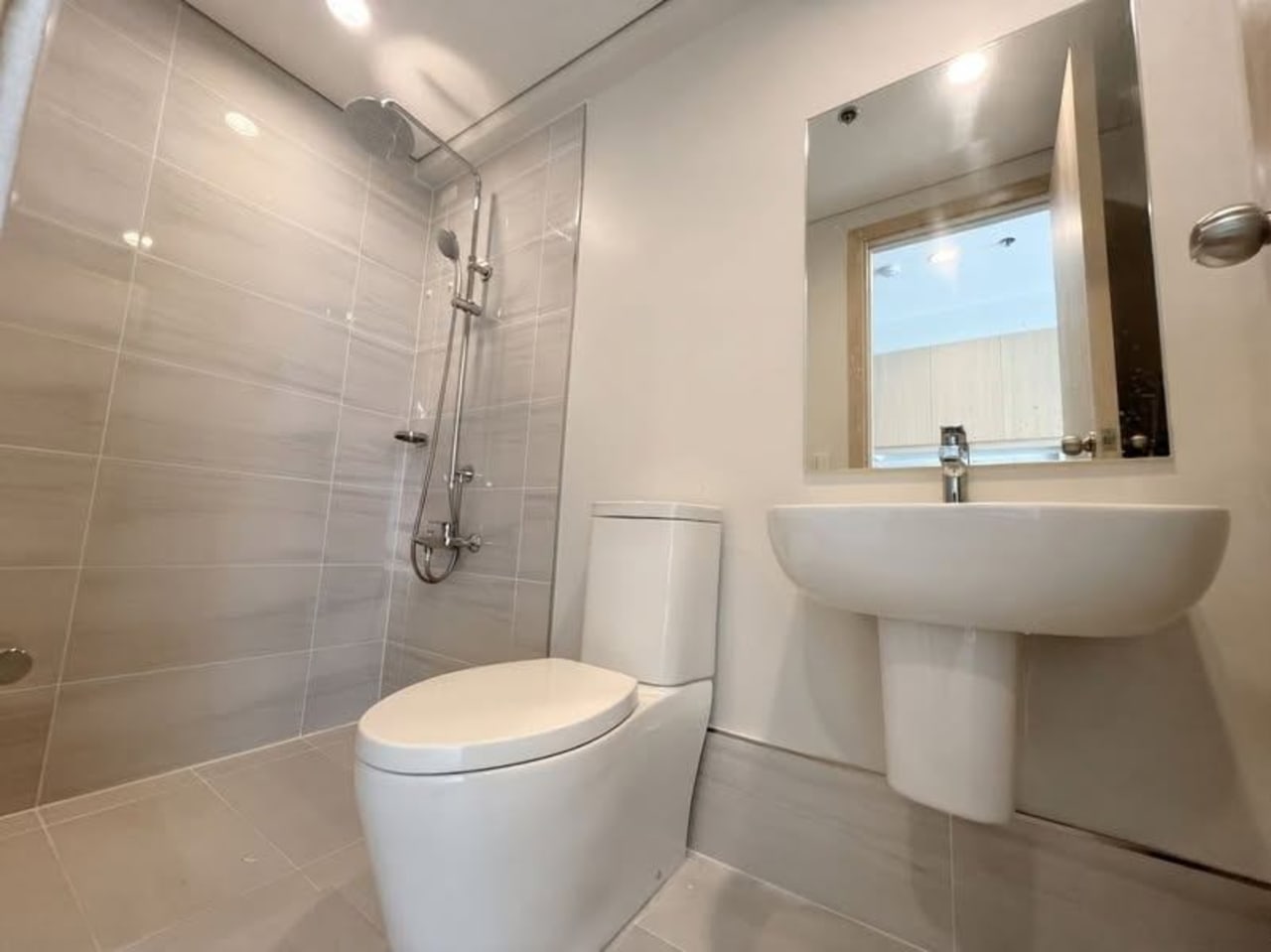 Bathroom with shower and vanity in studio condo for sale at Solinea Tower 4 Cebu