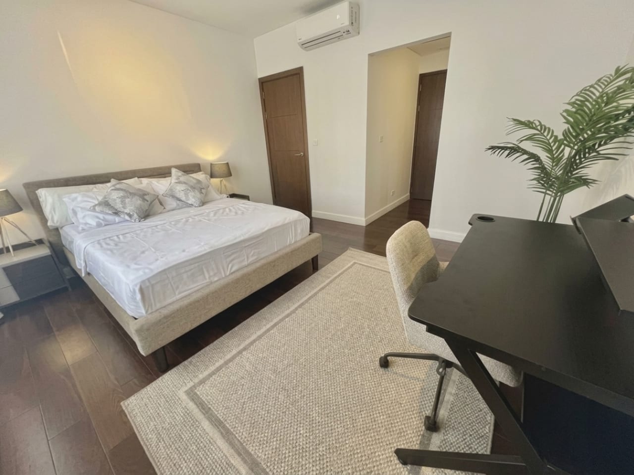 Spacious bedroom with king-size bed, work desk and built-in storage in The Alcoves condo Cebu