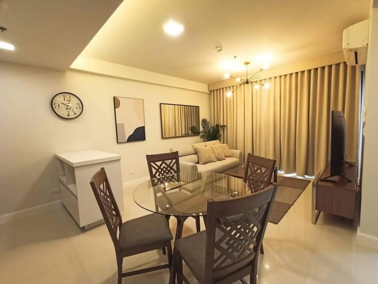 Fully furnished living and dining area in 1-bedroom condo for sale at The Alcoves Cebu