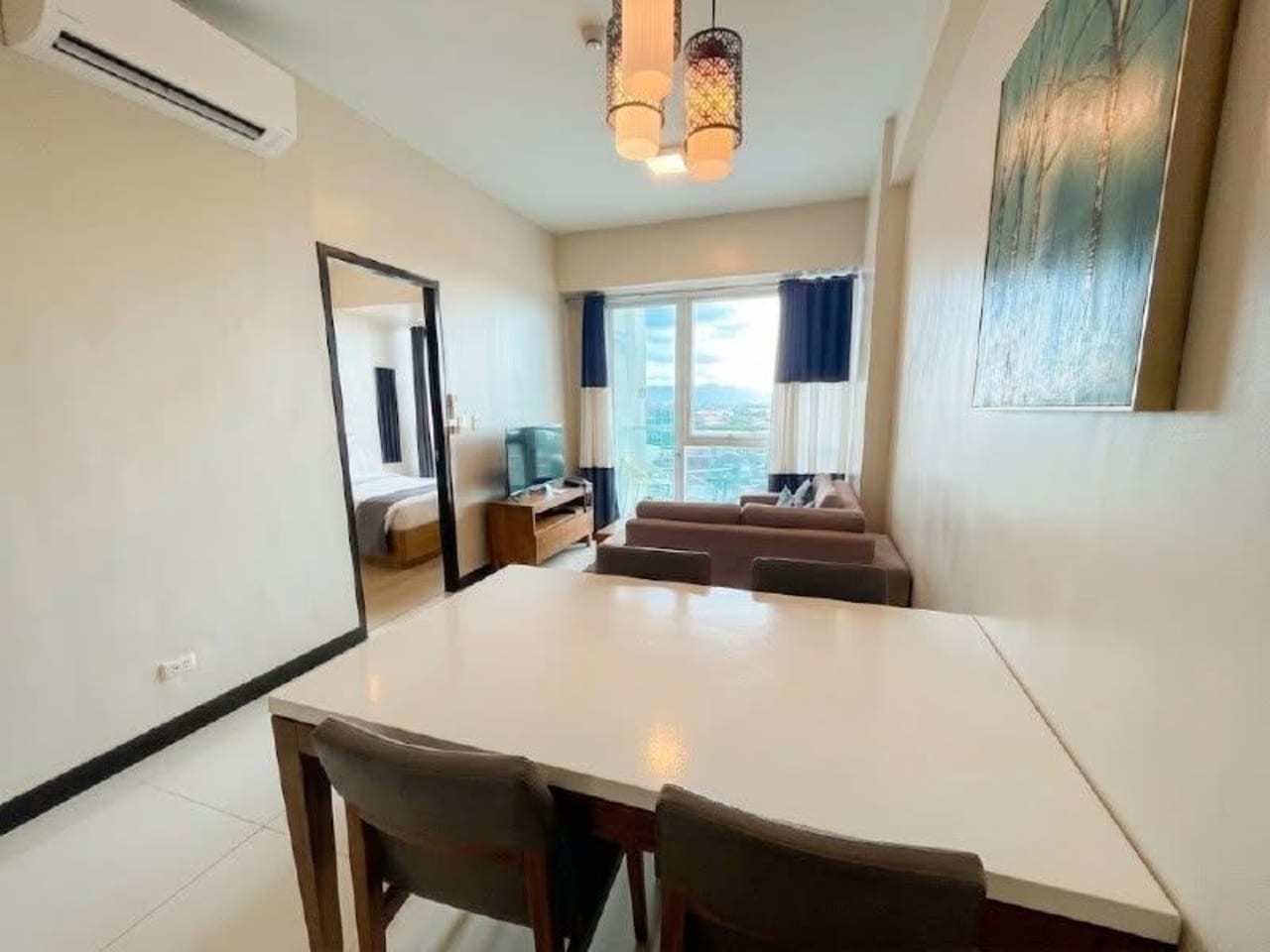 The Alcoves 1-bedroom condo dining and living area with modern furnishings in Cebu City