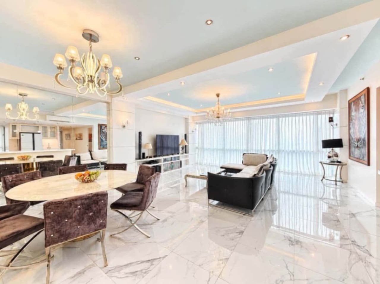 Spacious living and dining area with chandeliers, marble floors and floor-to-ceiling windows, Marco Polo Residences