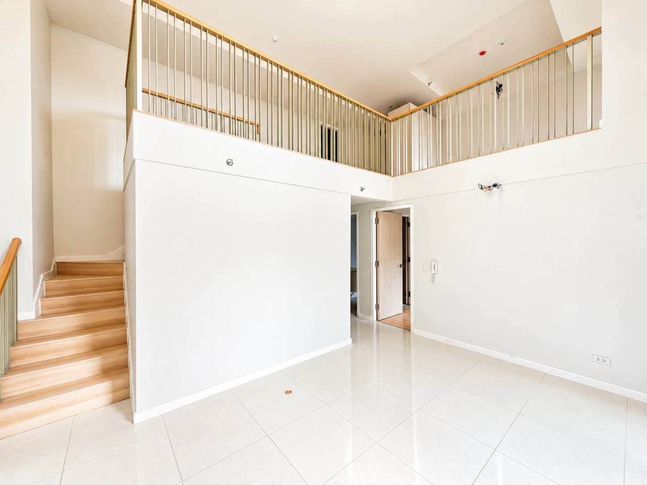 Interior staircase and open loft layout in a 2-bedroom condo for sale at Mandani Bay, Cebu
