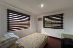 Bed with two windows in House & Lot for Sale in Liloan, Cebu