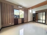 Bright living room with large windows in luxury townhouse in San Antonio Village Cebu