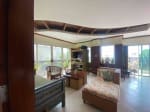 Living room with seating area inside waterfront house for sale in Mactan Cebu
