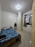 bedroom with blue mattress with white walls house and lot for sale in Tisa