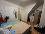 Inside a room facing the door with brown floor house and lot for sale in Tisa