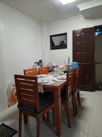 Brown dining table and chairs with white walls house and lot for sale in Tisa