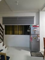 Window beside a gray refrigerator in house and lot for sale in Tisa