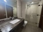 Modern bathroom with glass shower enclosure in fully furnished 1-bedroom condo at The Alcoves Cebu