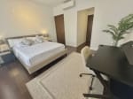 Spacious bedroom with king-size bed, work desk and built-in storage in The Alcoves condo Cebu