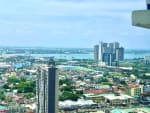 High-floor sea view overlooking Mandaue City, Cebu coastline and surrounding buildings from JTower Residences