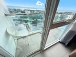 The Alcoves 32nd floor condo balcony with city view and outdoor seating in Cebu City