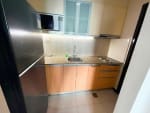 The Alcoves 1-bedroom condo kitchen with modern cabinets and built-in appliances